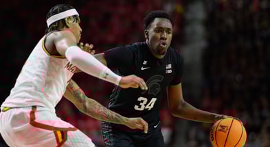 Michigan State Spartans forward Xavier Booker (34) handles the ball against Maryland Terrapins guard DeShawn Harris-Smith (5) during the first half at Xfinity Center. - Reggie Hildred, USA TODAY Sports