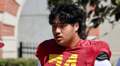 USC offensive tackle Justin Tauanuu walks to a spring practice with the Trojans
