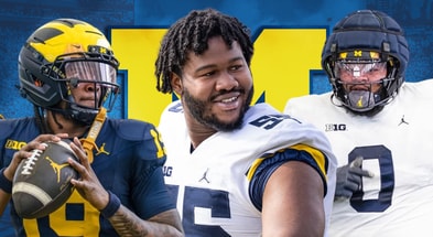 Michigan Wolverines football quarterback Bryce Underwood and defensive tackles Rayshaun Benny and Tré Williams.