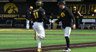 Iowa outfielder Miles Risley rounds the bases after hitting a home run against Nebraska. (Photo by Dennis Scheidt)