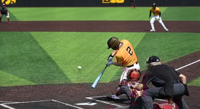 Iowa infielder Gable Mitchell drives in a run against Nebraska. (Photo by Dennis Scheidt)
