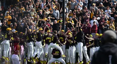 Iowa infielder Gable Mitchell celebrates a home run against Nebraska. (Photo by Dennis Scheidt)