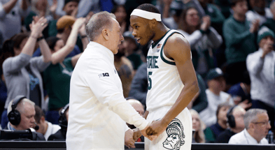 Michigan State Spartans head coach Tom Izzo talks with Michigan State Spartans guard Tre Holloman (5) in the second half against the Bryant University Bulldogs during the NCAA Tournament. - Rick Osentoski, USA TODAY Sports