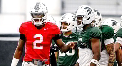 Michigan State quarterback Aidan Chiles, left, talks with Nick Marsh during a break in football practice on Tuesday, April 8, 2025, in East Lansing. - Nick King, USA TODAY Sports
