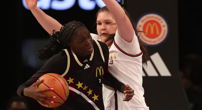 McDonald's All American West forward Brynn McGaughy (3) defends the basket from McDonald's All American East wing Agot Makeer (1) during the first half of the game at Barclays Center. Mandatory Credit: Pamela Smith-Imagn Images
