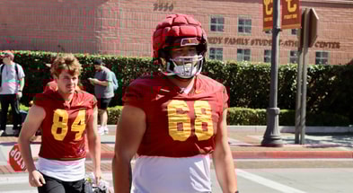 USC offensive lineman Hayden Treter walks to a spring practice with the Trojans