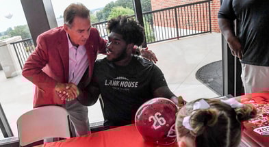 Nick Saban and Tyler Booker