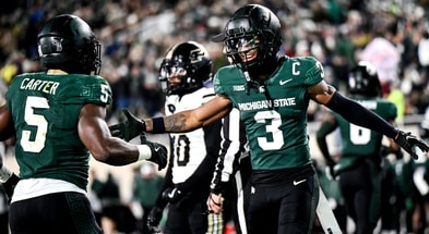 Michigan State's Montorie Foster Jr., right, celebrates with Nathan Carter, left, after Carter's touchdown against Purdue during the second quarter on Friday, Nov. 22, 2024, at Spartan Stadium - Nick King, USA TODAY Sports