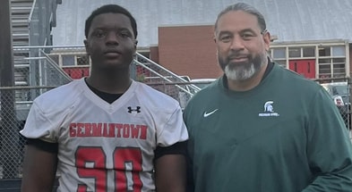 Michigan State DL coach Legi Suiaunoa visiting with Germantown (Tenn.) DL Djidjou Bah (photo via Djidjou Bah via Twitter).