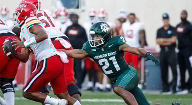Michigan State defensive back Dillon Tatum (21) tackles Maryland quarterback Taulia Tagovailoa (3) during the second half of MSU's 31-9 loss on Saturday, Sept. 23, 2023, in East Lansing. - Junfu Han, USA TODAY Sports