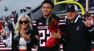 Nov 30, 2024; Lubbock, Texas, USA; Texas Tech Red Raiders defensive back Devynn Cromwell (22) is honored on senior day before the game against the West Virginia Mountaineers at Jones AT&T Stadium and Cody Campbell Field. (Photo Credit: Michael C. Johnson-Imagn Images)