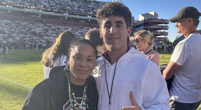 South Carolina baseball commitment Spencer Krasner posing with Gamecock women's basketball coach Dawn Staley during a visit to Columbia. Photo credit: Spencer Krasner | @kraz_sj on Twitter/X