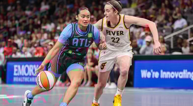 Atlanta Dream guard Te-Hina Paopao (2) drives on Indiana Fever guard Caitlin Clark (22) in the first half at State Farm Arena. Mandatory Credit: Brett Davis-Imagn Images