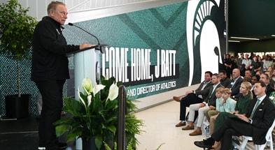 Michigan State University basketball coach Tom Izzo speaks Wednesday, June 4, 2025, before MSU President Kevin Guskiewicz introduced J Batt (bottom right) as the Spartans new athletic director. - Matthew Dae Smith