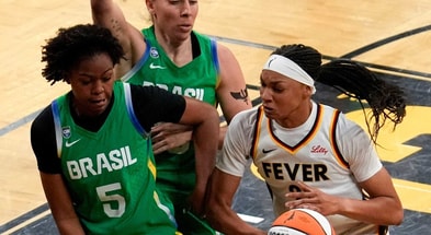 Indiana Fever forward-center Makayla Timpson (21) tries to gather the ball as Brazil's Ayla McDowell (5) defends during an WNBA game May 4, 2025 at Carver-Hawkeye Arena in Iowa City, Iowa.