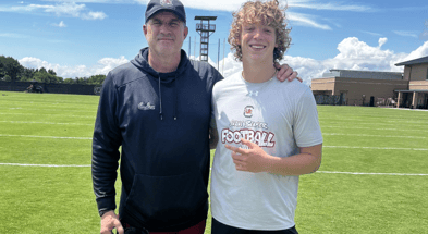 Class of 2028 quarterback Brady Quinn with South Carolina offensive coordinator Mike Shula. Photo credit: Brady Quinn | @QBQuinn2 on Twitter/X