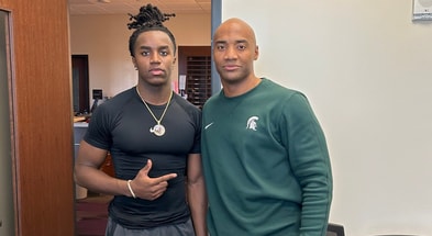 Michigan State DB commit Jordan Vann with Spartan safeties coach James Adams (photo courtesy of Jordan Vann via Twitter).