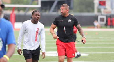 Eric McFarland and Brian Hartline by Mick Walker -- Lettermen Row --