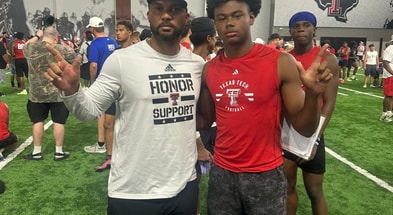 Texas Tech wide receiver coach Juice Johnson and Kobe Haynes