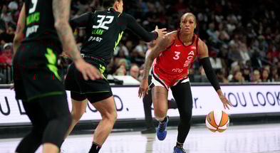 Las Vegas Aces guard Tiffany Mitchell (3) dribbles the ball against Seattle Storm forward Alysha Clark (32) during the first half of a WNBA basketball game at Michelob Ultra Arena. Mandatory Credit: Lucas Peltier-Imagn Images
