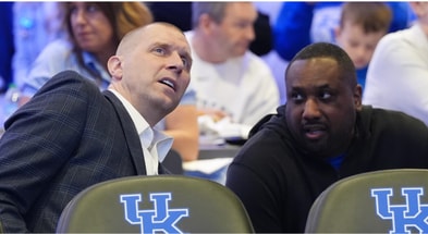 Kentucky’s head coach Mark Pope, left, watches the NCAA Tournament Selection Show inside Rupp Arena Sunday night. March 16, 2025. © Scott Utterback/Courier Journal / USA TODAY NETWORK via Imagn Images