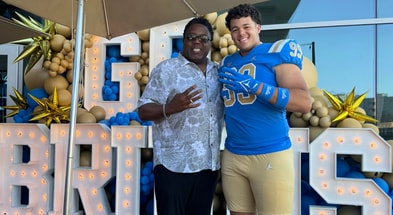 Recruit Marcus Almada and UCLA DL coach Jethro Franklin