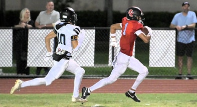 Dylan Faison runs away from a defender during his junior season at Boca Raton (Fla.) Saint Andrew’s.