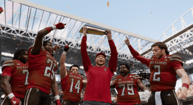 Texas Tech head coach Joey McGuire holds up national championship trophy