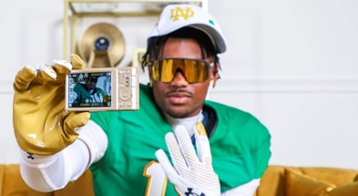 Nick Reddish poses with a camera on his Notre Dame official visit