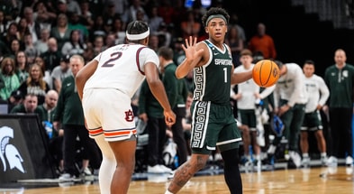 Michigan State guard Jeremy Fears Jr. (1) dribbles against Auburn guard Denver Jones (2) during the first half of the Elite Eight round of NCAA tournament at State Farm Arena in Atlanta. - Junfu Han, USA TODAY Sports