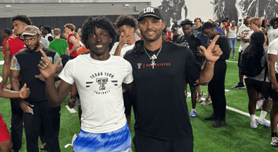 Samuel Williams with Texas Tech WR's coach Juice Johnson