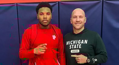 Michigan State EDGE commit Chris Addison with Spartan rush ends coach Chad Wilt (photo courtesy of Chris Addison via Twitter).
