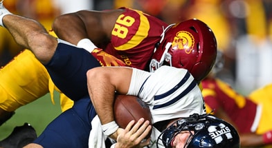 USC Trojans defensive end Devan Thompkins (98) sacks Utah State Aggies quarterback Bryson Barnes (16) during the third quarter at United Airlines Field at Los Angeles Memorial Coliseum