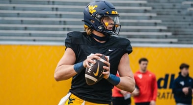 West Virginia quarterback Scotty Fox drops back to pass