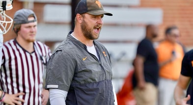 TE Coach Alec Abeln provides instruction during group drill