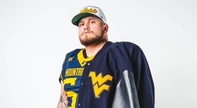 West Virginia offensive lineman Ayden Bussell announces his departure
