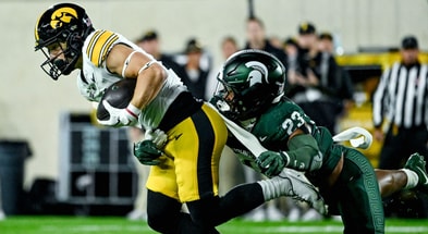 Michigan State's Darius Snow, right, tackles Iowa's Kaden Wetjen in the first quarter on Saturday, Oct. 19, 2024, at Spartan Stadium in East Lansing. - Nick King, USA TODAY Sports