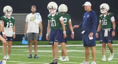 Georgia Tech QB coach Chris Weinke with Haynes King and other quarterbacks
