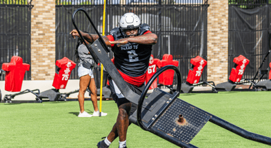 Texas Tech defensive tackle Lee Hunter drives a sled during preseason practice after being named to the 2025 Bednarik Award watch list