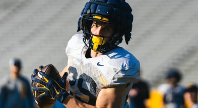 West Virginia wide receiver Preston Fox brings in the catch