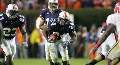 Carnell Williams runs the football during the 2004 season, with teammates Ronnie Brown and Jason Campbell in the background. (Photo by USA Today)