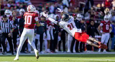 Nov 16, 2024; Stanford, California, USA; Louisville Cardinals defensive back D'Angelo Hutchinson (21) attempts to deflect a pass to Stanford Cardinal wide receiver Emmett Mosley V (10) during the first quarter at Stanford Stadium. Mandatory Credit: Bob Kupbens-Imagn Images