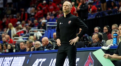 Mar 20, 2025; Lexington, KY, USA; Louisville Cardinals head coach Pat Kelsey looks on during the first half of the game against the Creighton Bluejays in the first round of the NCAA Tournament at Rupp Arena. Mandatory Credit: Jordan Prather-Imagn Images