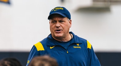 West Virginia head coach Rich Rodriguez addresses his team