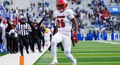 Nov 30, 2024; Lexington, Kentucky, USA; Louisville Cardinals running back Duke Watson (26) carries the ball into the end zone for a touchdown during the third quarter against the Kentucky Wildcats at Kroger Field. Mandatory Credit: Jordan Prather-Imagn Images