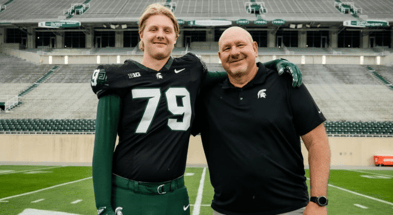 Michigan State OL commit Tristan Comer with Spartan offensive line coach Jim Michalczik.