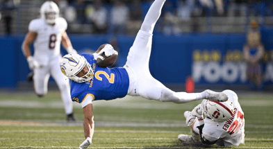 Nov 29, 2024; San Jose, California, USA; San Jose State Spartans wide receiver TreyShun Hurry (2) gets tripped up by Stanford Cardinal safety Scotty Edwards (21) in the second quarter at CEFCU Stadium. Mandatory Credit: Eakin Howard-Imagn Images