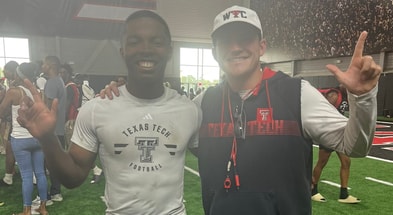Forney RB Taylor Hunley with Texas Tech assistant coach Garret McGuire