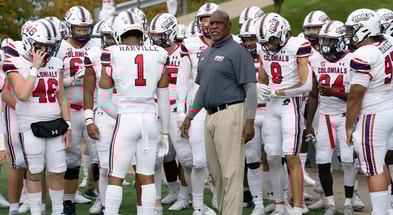 Robert Morris head football coach Bernard Clark Jr. and his team take the field
