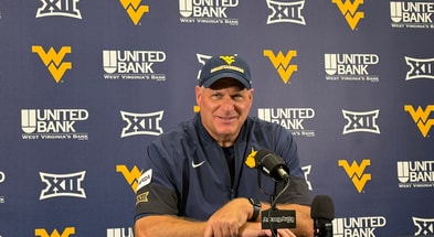 West Virginia head coach Rich Rodriguez talks with the media following the Robert Morris win